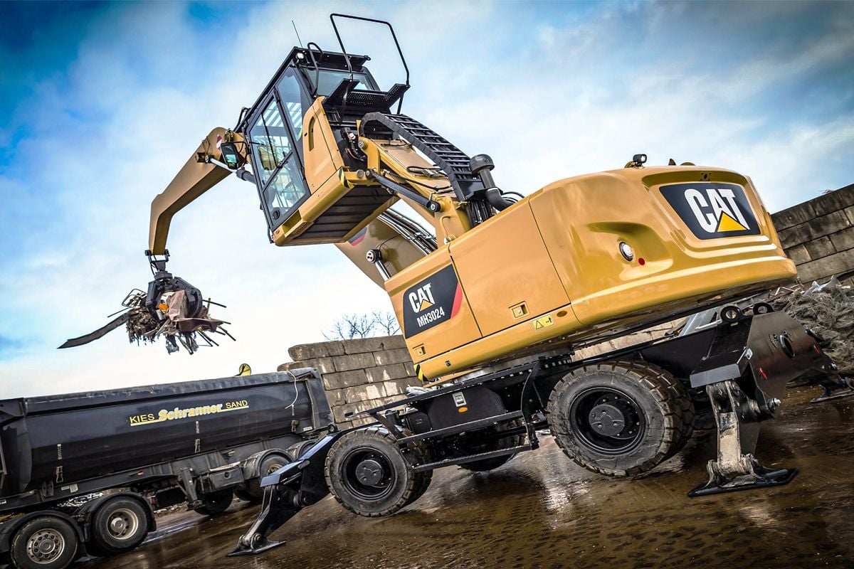 MH3024 Wheel Material Handler Loading a Truck with Scrap Metal